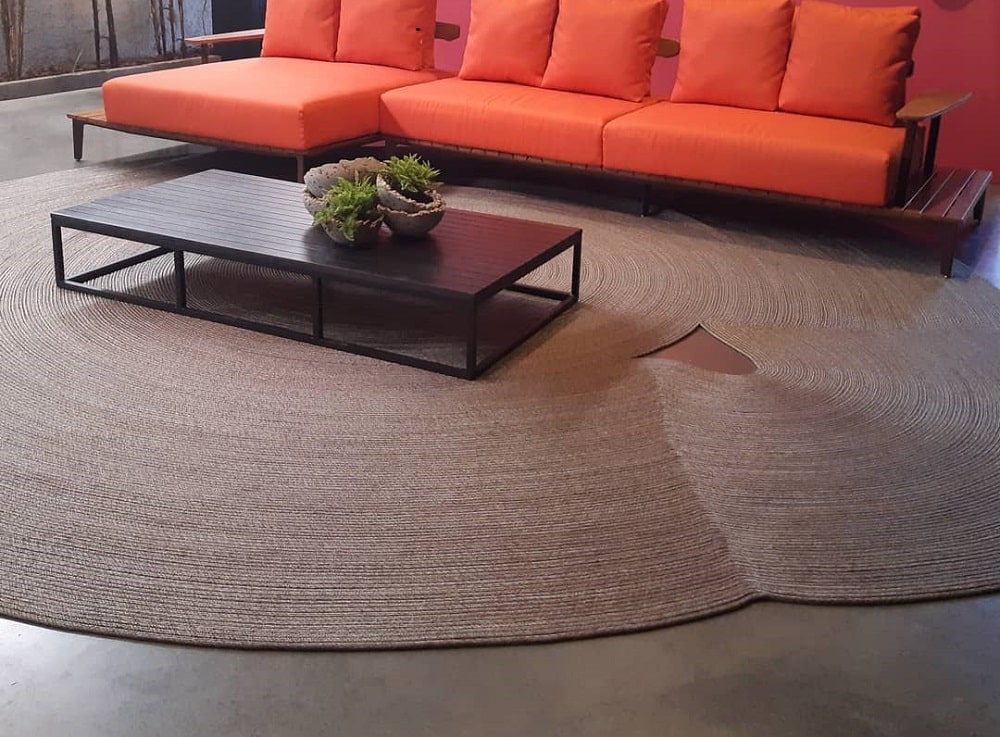 Add an oversized pattern rug to anchor the space