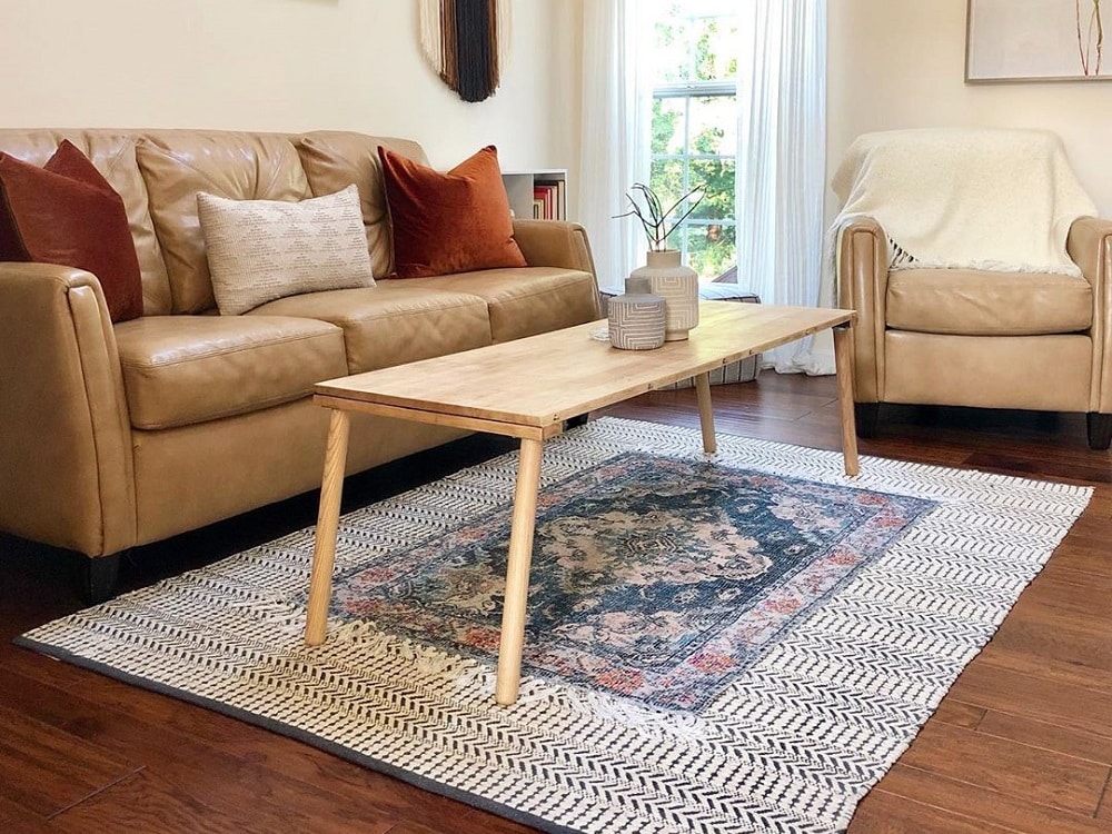 Layer two differently patterned rugs